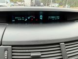a car dashboard with a digital clock on it