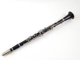 a close up of a black and silver clarinet on a white background