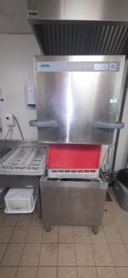 a kitchen with a stove, sink, and dishwasher in it