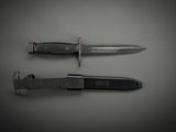 two knives that are laying side by side on a table