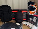 a box with a helmet, gloves, and other items on it