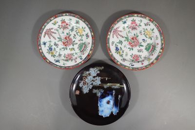 three plates on the wall with a picture of a vase on them