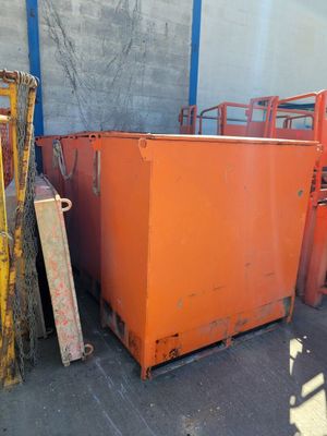 many orange containers sitting next to each other in a warehouse