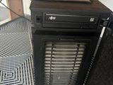 a computer tower with a hard drive on top of it