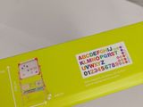 a yellow box that has a picture of a cat on it