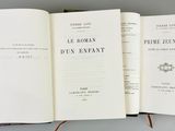 a open book with a pen on top of it
