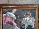 a man taking a picture of himself in a mirror