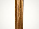 an image of a tall gold column with a white background
