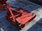 an image of a red machine with chains attached to it