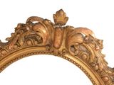 a mirror with a gold frame on a white background