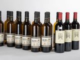 plusieurs bouteilles de vin sont alignées sur une table