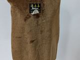 an image of a brown vest on a mannequin stand