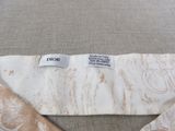 a close up of a necktie with a label on it