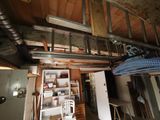a picture of a room that has a ladder in it