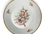 une image représentant une assiette sur laquelle figure un chat
