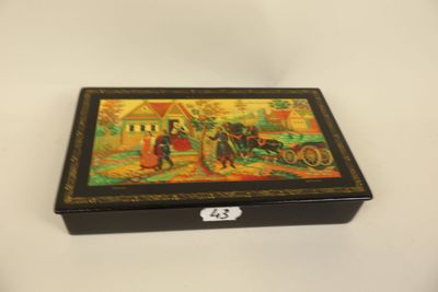 an image of a box with a painting on it sitting on a table