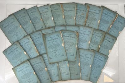 a lot of old papers that are in a white box