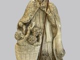 une image représentant la statue d'un homme accompagné d'un chien et d'un panier