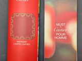 an open red book with a picture of apples in the background