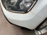 a close up of a car ' s headlight on the side of the road