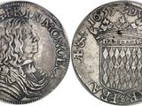 une pièce d'argent surmontée d'une couronne