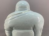 an image of a blue and white ceramic statue of a man