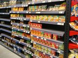 a lot of snacks on the shelves in the store