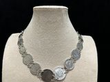 a close up of a necklace on a mannequin mannequin