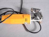 a small electric tool that is sitting on a table