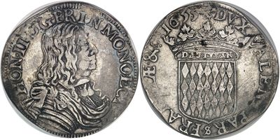 a silver coin with a crown on top of it