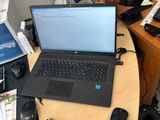 a desk with a laptop and a mouse on it