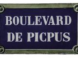 blue and white sign with white writing on it that says boulevard de picbus