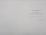 an open book with a handwritten poem on it