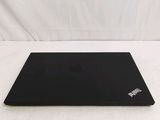 a black laptop on a white surface with a white background