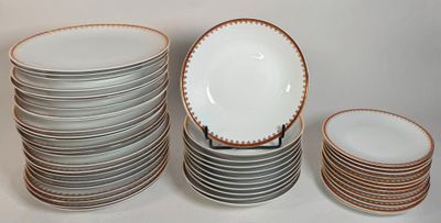 many plates stacked on top of each other on a table