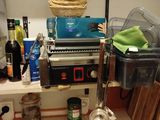 a kitchen with a lot of clutter on the counter