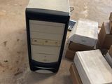 a desktop computer sitting on top of a cart in a warehouse