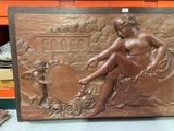 a bronze plaque of a woman and a child