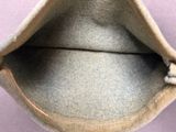 a close up of a bag with a cat inside of it