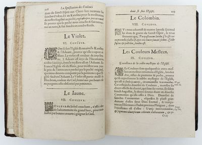 a book open on a white surface with a black border