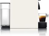 an image of a coffee machine next to a glass of water