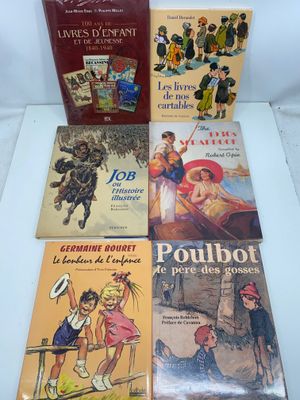 four children ' s books are lined up on a table