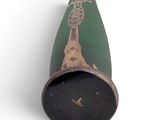 a green tube with a picture of a person on it