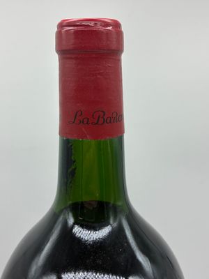 a bottle of wine that is sitting on a table