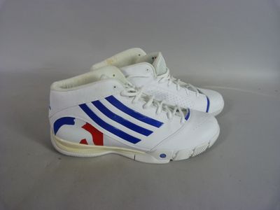 adidas basketball shoes with blue and red stripes on the sole
