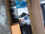 a cardboard box full of electronic equipment on the floor