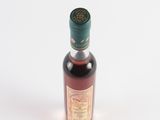 an image of a bottle of liquor on a white surface
