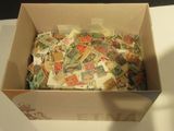 a box full of postage stamps sitting on a table
