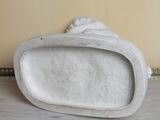 a marble sculpture of a shell on a marble table