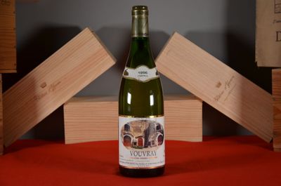 a bottle of wine that is sitting on a table